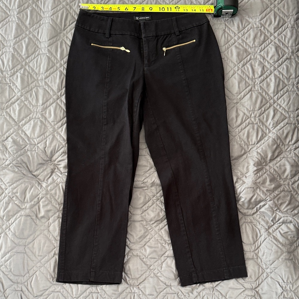 Women's Black capri pants with zipper detail.
